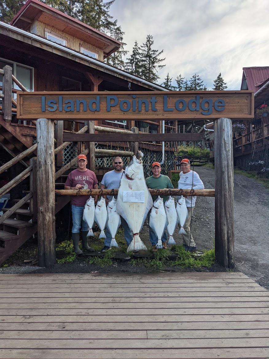 Group photo at Island Point Lodge with a day's haul of halibut